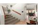 Welcoming entryway with carpeted staircase and view of living area featuring tile flooring at 1202 E Desert Broom Way, Phoenix, AZ 85048