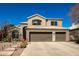 Charming two-story stucco home with a three-car garage and a well-manicured front yard at 1202 E Desert Broom Way, Phoenix, AZ 85048