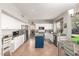 Spacious kitchen featuring white cabinets, granite countertops, and stainless steel appliances at 1202 E Desert Broom Way, Phoenix, AZ 85048