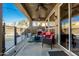 Inviting covered patio with outdoor seating, ceiling fans, a grill, and a pool view, perfect for relaxing and entertaining at 1202 E Desert Broom Way, Phoenix, AZ 85048