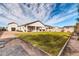 Expansive backyard with lush lawn, covered patio, and ample space for recreation and relaxation at 1291 E La Fortuna Ct, San Tan Valley, AZ 85140