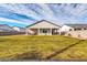 Spacious backyard with lush lawn and covered patio, perfect for outdoor entertaining and relaxation at 1291 E La Fortuna Ct, San Tan Valley, AZ 85140