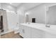 Bathroom with white cabinets, double sinks, and a shower-tub combo with white subway tile at 1291 E La Fortuna Ct, San Tan Valley, AZ 85140