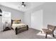 This bright bedroom includes neutral walls, carpeted floors, and a decorative ceiling fan at 1291 E La Fortuna Ct, San Tan Valley, AZ 85140