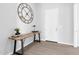 Bright hallway features wood flooring, decorative table, and a white door at 1291 E La Fortuna Ct, San Tan Valley, AZ 85140