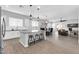 Open concept kitchen with a center island, pendant lighting, and a seating area at 1291 E La Fortuna Ct, San Tan Valley, AZ 85140