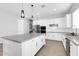 Bright kitchen with a center island, stainless steel appliances, and white cabinets at 1291 E La Fortuna Ct, San Tan Valley, AZ 85140