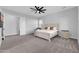 Spacious main bedroom features a ceiling fan, neutral paint, and a carpeted floor at 1291 E La Fortuna Ct, San Tan Valley, AZ 85140