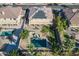 A pristine backyard with pool, lush grass and blue lounge chairs creates an inviting outdoor space at 12925 W Llano Dr, Litchfield Park, AZ 85340