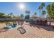 Outdoor patio with palm trees, complete with a built in kitchen area and sitting at 12925 W Llano Dr, Litchfield Park, AZ 85340