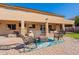 Spacious backyard patio, perfect for outdoor entertaining, with ample seating and a cozy ambiance at 12925 W Llano Dr, Litchfield Park, AZ 85340