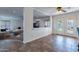 Bright dining area featuring tile flooring, white trim, and an open view of the living area at 12925 W Llano Dr, Litchfield Park, AZ 85340