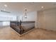 Second floor hallway featuring decorative lighting, beautiful railing, and elegant tile flooring at 12925 W Llano Dr, Litchfield Park, AZ 85340