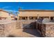 Exterior kitchen with granite countertops, stainless steel grill and sink at 12925 W Llano Dr, Litchfield Park, AZ 85340