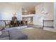 Open-concept living room with a view of the upper level, elegant chandelier, and spacious dining area at 12925 W Llano Dr, Litchfield Park, AZ 85340