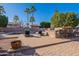 Backyard pool with a large patio featuring an outdoor kitchen and lounge chairs at 12925 W Llano Dr, Litchfield Park, AZ 85340