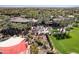 Aerial view of a resort with lush landscaping, a pool, and a sprawling golf course at 12956 W Eagle Ridge Ln, Peoria, AZ 85383