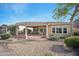 Spacious backyard featuring a covered patio and low-maintenance desert landscaping at 12956 W Eagle Ridge Ln, Peoria, AZ 85383