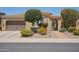 Charming single-story home featuring desert landscaping, gated front entry and attached two-car garage at 12956 W Eagle Ridge Ln, Peoria, AZ 85383
