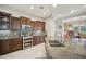 Modern kitchen featuring stainless steel appliances, granite countertops, and decorative backsplash at 12956 W Eagle Ridge Ln, Peoria, AZ 85383