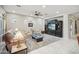 Cozy living room with large media center, ceiling fan, and neutral walls at 12956 W Eagle Ridge Ln, Peoria, AZ 85383