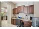 Home office nook with wood cabinetry, counter space and modern appliances at 12956 W Eagle Ridge Ln, Peoria, AZ 85383