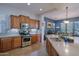 Well-equipped kitchen with stone countertops and eat in dining area at 13054 W Big Oak St, Peoria, AZ 85383