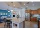 Kitchen island with seating, pendant lights and Stainless Steel appliances at 13054 W Big Oak St, Peoria, AZ 85383