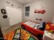 Themed bedroom with a race car bed and complementary decor for children at 13487 W Buckskin Trl, Peoria, AZ 85383