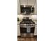 Stainless steel gas range with oven and microwave at 13487 W Buckskin Trl, Peoria, AZ 85383