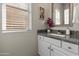 Bathroom features granite countertops, vanity, window, and stylish decor at 14309 W Weldon Ave, Goodyear, AZ 85395