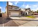 View of two-story home featuring a two car garage, desert landscaping and a front yard at 14309 W Weldon Ave, Goodyear, AZ 85395