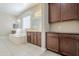 Bathroom with bathtub, vanities and storage is both functional and sophisticated at 14762 W Georgia Dr, Surprise, AZ 85379