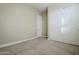 Bedroom with a sliding closet for storage and neutral carpet flooring at 14762 W Georgia Dr, Surprise, AZ 85379