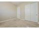 Bedroom with a closet for storage and neutral carpet flooring at 14762 W Georgia Dr, Surprise, AZ 85379