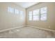 Bright bedroom featuring multiple windows offering an abundance of natural light at 14762 W Georgia Dr, Surprise, AZ 85379