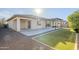 Wide angle shot of back of the house, showing 2 patios and backyard at 14762 W Georgia Dr, Surprise, AZ 85379