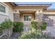 Eye-catching exterior view featuring stone accents, lush greenery, and a welcoming entry at 14762 W Georgia Dr, Surprise, AZ 85379