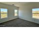 Cozy, carpeted bedroom with bright, natural light coming in from multiple windows at 1588 N Pueblo Dr, Apache Junction, AZ 85120