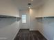 Spacious walk-in closet providing ample storage with built-in shelving and natural light at 1588 N Pueblo Dr, Apache Junction, AZ 85120