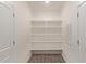 Walk-in pantry with ample shelving for organized storage at 1588 N Pueblo Dr, Apache Junction, AZ 85120