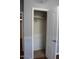 An empty walk-in closet with white walls and a shelf with a hanging rod at 17016 N 66Th Ter, Glendale, AZ 85308