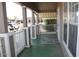 View of the home's charming front porch with painted wood and view of neighborhood at 17016 N 66Th Ter, Glendale, AZ 85308