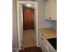 View of a modern kitchen area leading to a hallway at 17016 N 66Th Ter, Glendale, AZ 85308