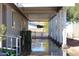 View of home's covered side patio with support beams and metal awning at 17016 N 66Th Ter, Glendale, AZ 85308