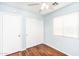 Bedroom featuring hardwood floors, closet, ceiling fan, and a window at 1793 S Valley Dr, Apache Junction, AZ 85120