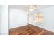 Bright bedroom featuring wood floors, a ceiling fan, and a window providing natural light at 1793 S Valley Dr, Apache Junction, AZ 85120