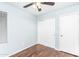 Bedroom with ceiling fan, closet, window and hardwood floors at 1793 S Valley Dr, Apache Junction, AZ 85120