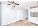 Open dining area leading to the kitchen, with a ceiling fan and neutral tile floor at 1793 S Valley Dr, Apache Junction, AZ 85120