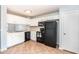 Well-lit kitchen featuring white cabinets, black appliances, and neutral countertops at 1793 S Valley Dr, Apache Junction, AZ 85120